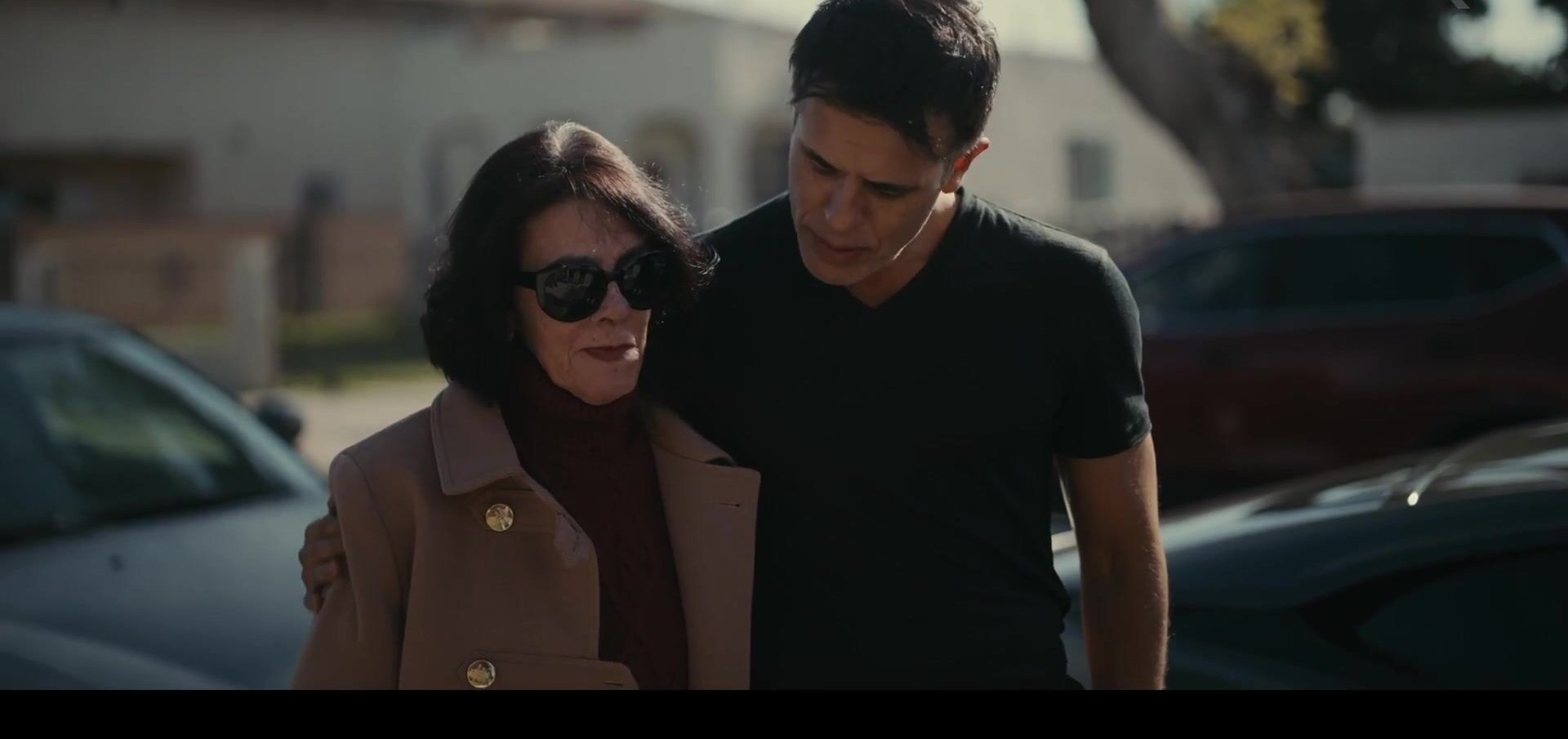 Two of the film's subjects walking a residential street